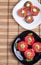 Top view of a plate of stewed eggplant and red tomatoes