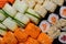 Top view of plate with sushi or maki. Fish food. Rolls with salmon, tuna, crab and avocado