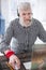 Top view of pleasant elderly man enjoying online games