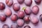 Top view of plum fruits on violet background