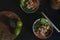 Top view of poke bowl with salmon and avocado on dark background. Hawaiian cuisine