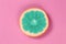 Top view popart grapefruit green color on a pink background