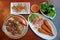 Top view of popular Vietnamese dishes on the wooden table