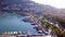 Top view of port with sea vessels at resort mountain town. Clip. Beautiful seaport with yachts and ships in background