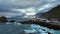 Top view of Porto Moniz town on Madeira island. Mountains on Madeira. Stormy Atlantic ocean near Madeira. Volcanic water