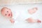 Top view portrait of happy infant baby laying in crib