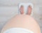 Top view of a pregnant woman with a bare tummy standing on an electronic scale.