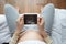 Top view pregnant woman holding ultrasound scan on her belly on sofa at home