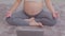 Top view Pregnant woman practice yoga online class lotus pose to meditation smile with big belly after wake up in the morning,