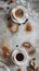 Top view of professional product photography from an elegant coffee space next to scattered cups and saucers.coffee art in
