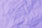 Top view of purple crumpled paper background