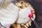 Top view of putting batter on cutting apples before baking on wooden background