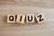 Top view quiz letters alphabet wooden cubes on wooden background