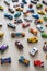 Top view random collection of model sport car toy hot wheels on wooden floor