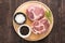 Top view raw fresh meat and garlic, pepper on wooden background