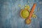 Top view of raw green unroasted coffee with ground beans in wooden bowl and spoon