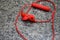 Top view of red color wireless earphone or ear buds