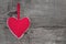 Top view of red dotted heart decoration on wooden background - c