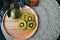 Top view of Red Kiwifruit on Wooden Plate