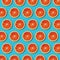 Top view red orange slices pattern on vibrant turquoise background