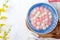 Top view of red and white tangyuan in blue bowl on white background for Winter solstice