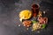 Top view of a refreshing alcoholic beverage with snacks. Beer and salty appetizers on a gray stone background. Copy