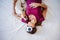 Top view of relaxed caucasian woman at home wearing panda eye mask while resting on bed with cute jack russell dog. Pets, love and