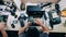 Top view of a repairman dismantling a laptop