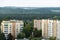 top view of the residential area of a small city. View of the houses of a residential complex in a green area next to trees. A