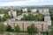 top view of the residential area of a small city. View of the houses of a residential complex in a green area next to trees. A