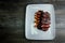 top view on restaurant dish of barbecued sliced meat with wild rice