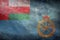 Top view retro of Air Force Ensign of Oman , with grunge texture. Oman travel and patriot concept. no flagpole. Plane design,
