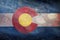 Top view of retro flag of Colorado with grunge texture. Flag background