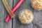 Top View on Rhubarb muffin in paper cups with rhubarb petioles i