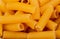 top view of rigatoni pasta as background