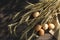 Top view of ripe wheat stems, eggs, sackcloth on the wooden background