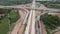 Top view of  road under construction with heavy machinery and workers.