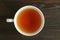 Top View of Roasted Barley Tea or Japanese Mugicha on Dark Brown Wooden Table