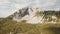 Top view of rock erosion. Stock. Panoramic view of heavily textured and eroded white rock. Green cover of rocky surface