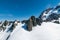 Top view rock mountain against blue sky with snow