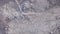 Top view of rocky stone terrain. Clip. Texture of stone lifeless land high in mountains. Grey area with no vegetation