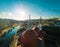 A top view of the roof of sao gonÃ§alo church in amarante and a beautifull sky with the sun and the tamega river in background