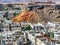 Top view of the roofs of residential buildings with water barrels