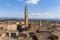 Top view of the rooftops, bell tower and surroundings of Siena, Italy