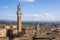 Top view of the rooftops, bell tower and surroundings of Siena, Italy