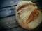 top view of round bread. Delicious fresh cornbread with sprinkles on an old wooden table. Copy space. Traditional