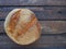 top view of round bread. Delicious fresh cornbread with sprinkles on an old wooden table. Copy space. Traditional