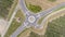 Top view of a roundabout at the entrance to a small town with farmlands in Slovenia