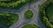 Top view of the roundabout with passing cars against a backdrop of the track