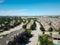 Top view row of new development three story townhomes next to single family residential area with highway in background